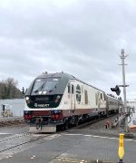 Amtrak Cascades Train # 504 is about to pass through Downtown Kent. An SC-44 is leading a short horizon set with an F40 cabbage car on the rear